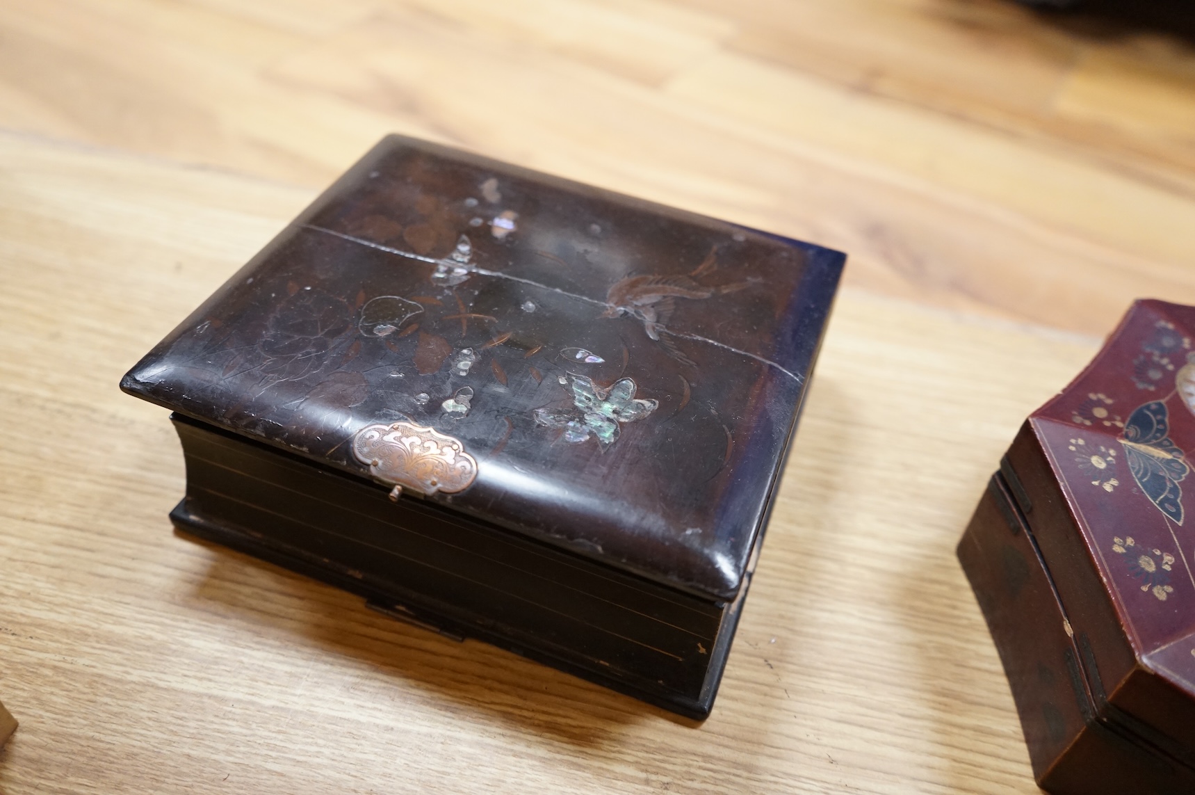 A group of 19th/20th century Japanese lacquer boxes and a similar tabletop cabinet, the latter 31cm wide